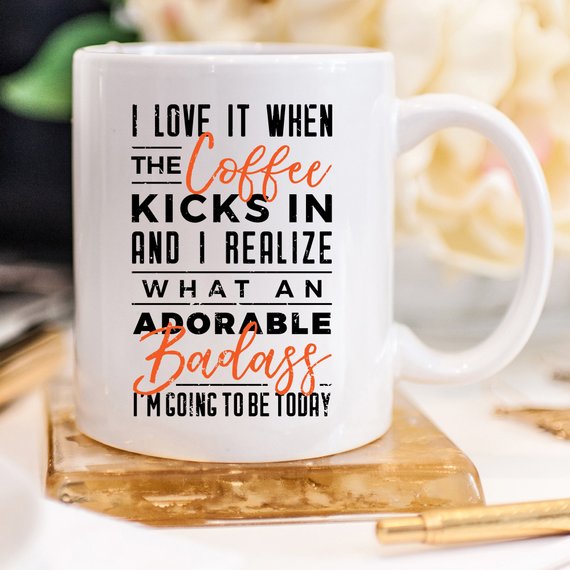 A humorous coffee mug with the phrase 'I Love It When the Coffee Kicks In', showcasing a fun design perfect for coffee lovers.