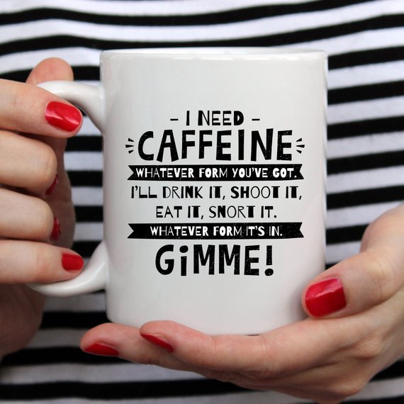 Funny coffee mug with humorous caffeine quote, perfect for coffee lovers.