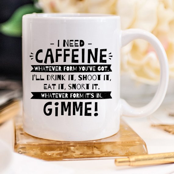 Funny coffee mug with humorous caffeine quote, perfect for coffee lovers.