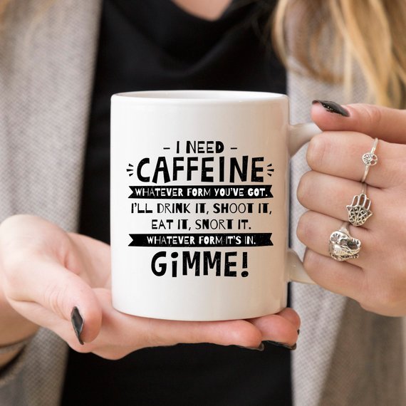 Funny coffee mug with humorous caffeine quote, perfect for coffee lovers.