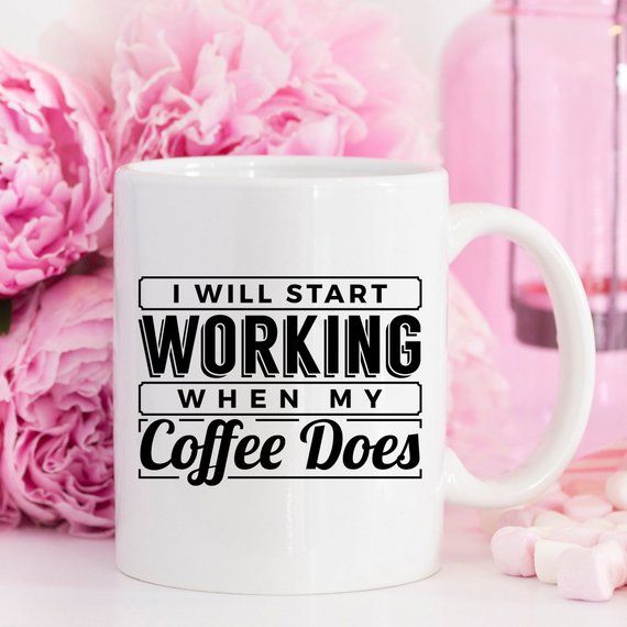 A humorous coffee mug with the phrase 'I Start Working When My Coffee Starts Working', crafted from high-quality ceramic, perfect for coffee lovers.