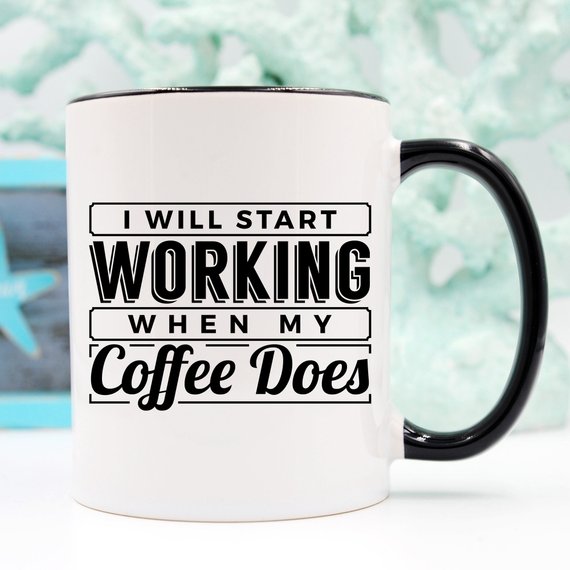 A humorous coffee mug with the phrase 'I Start Working When My Coffee Starts Working', crafted from high-quality ceramic, perfect for coffee lovers.