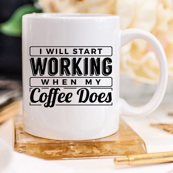 A humorous coffee mug with the phrase 'I Start Working When My Coffee Starts Working', crafted from high-quality ceramic, perfect for coffee lovers.