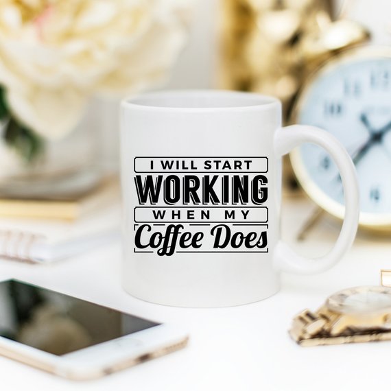 A humorous coffee mug with the phrase 'I Start Working When My Coffee Starts Working', crafted from high-quality ceramic, perfect for coffee lovers.