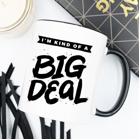 A humorous 11oz coffee mug with the phrase 'I'm Kind Of A Big Deal' printed on it, showcasing a fun and playful design.