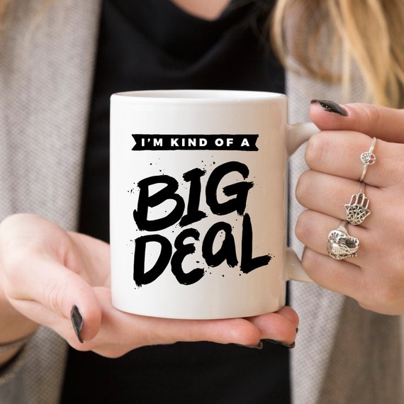 A humorous 11oz coffee mug with the phrase 'I'm Kind Of A Big Deal' printed on it, showcasing a fun and playful design.