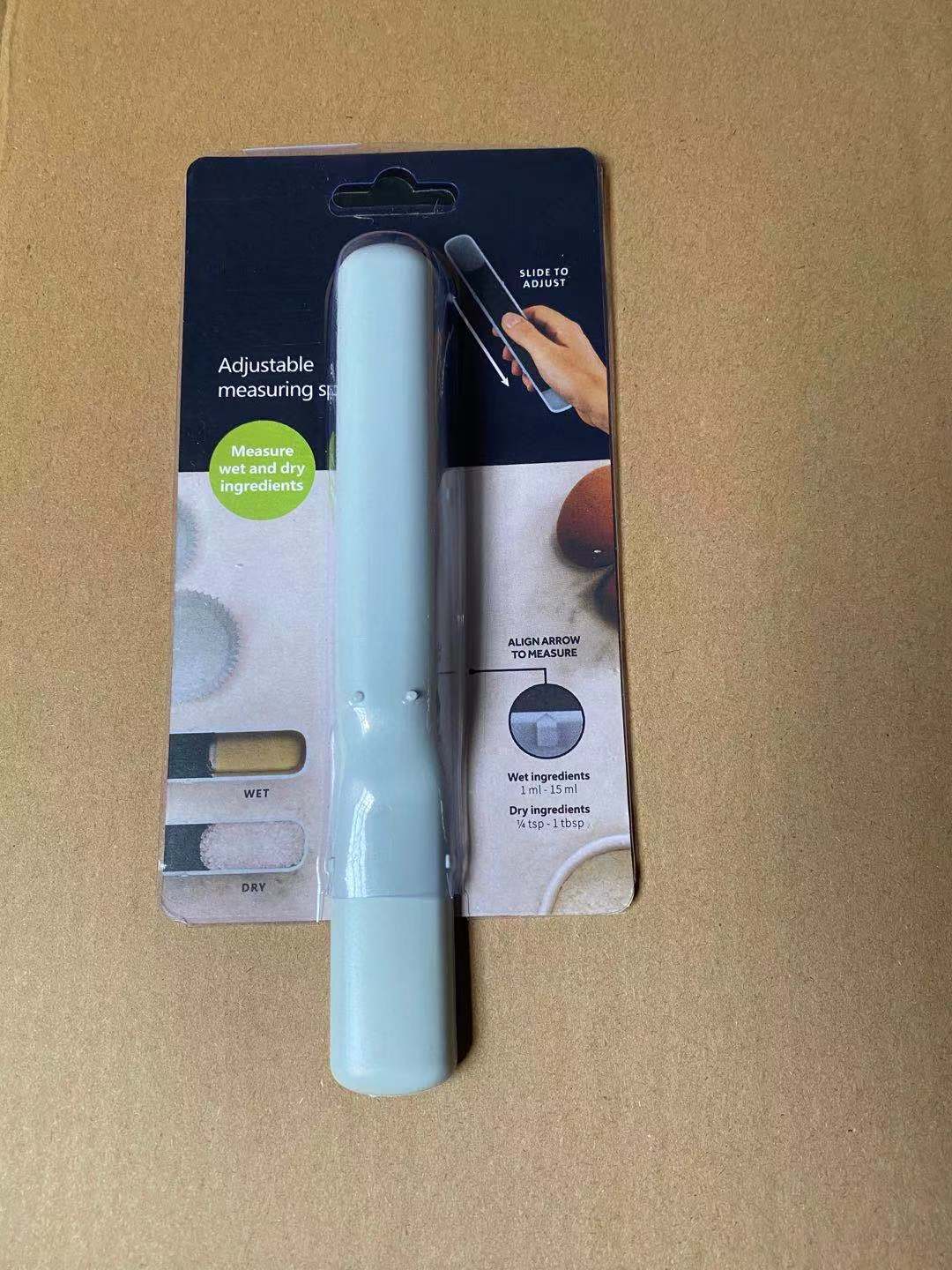 Kitchen Household 12 Speed Adjustable Measuring Spoon with scale, featuring a smooth surface and printed capacity markings.