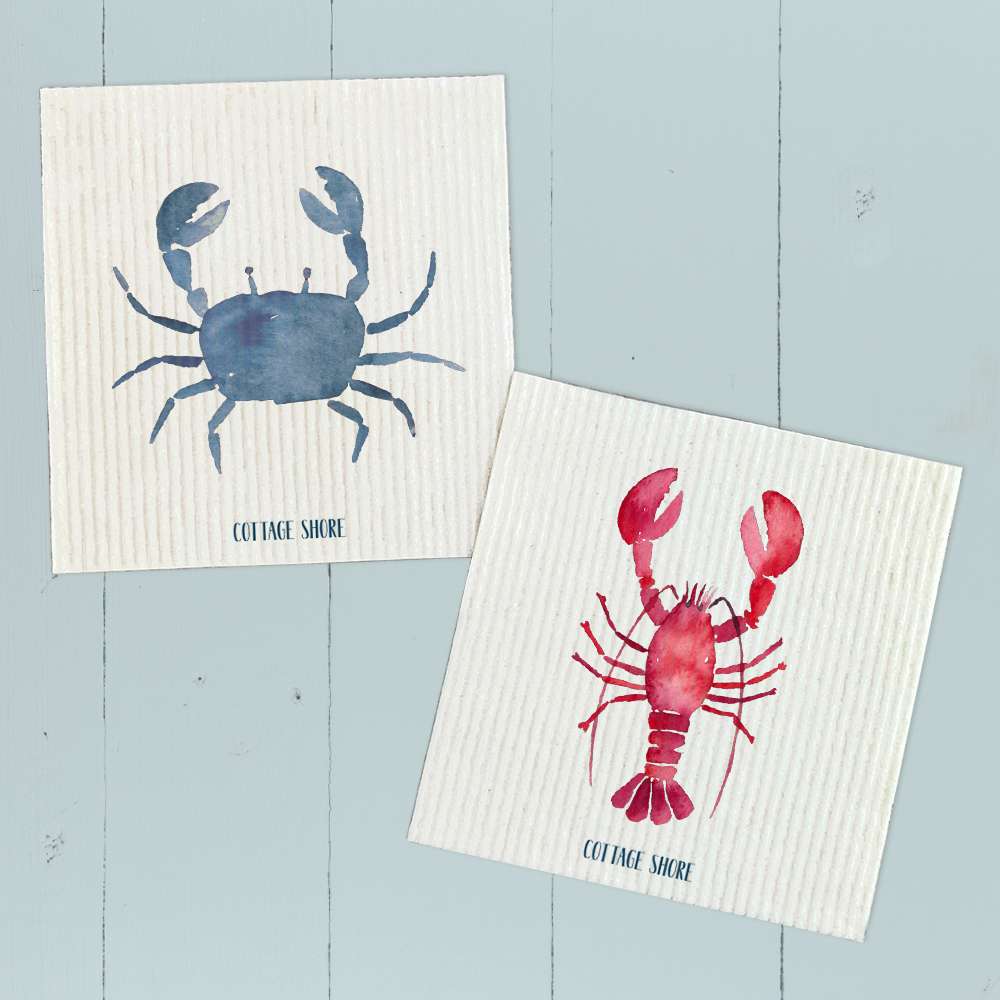 Two Swedish dish cloths featuring lobster and blue crab designs, made from eco-friendly materials.
