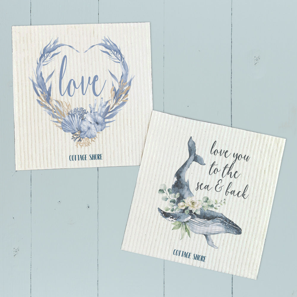 Two eco-friendly Swedish dishcloths featuring Love Ocean Wreath and Love Whale designs, made from plant-based fibers.