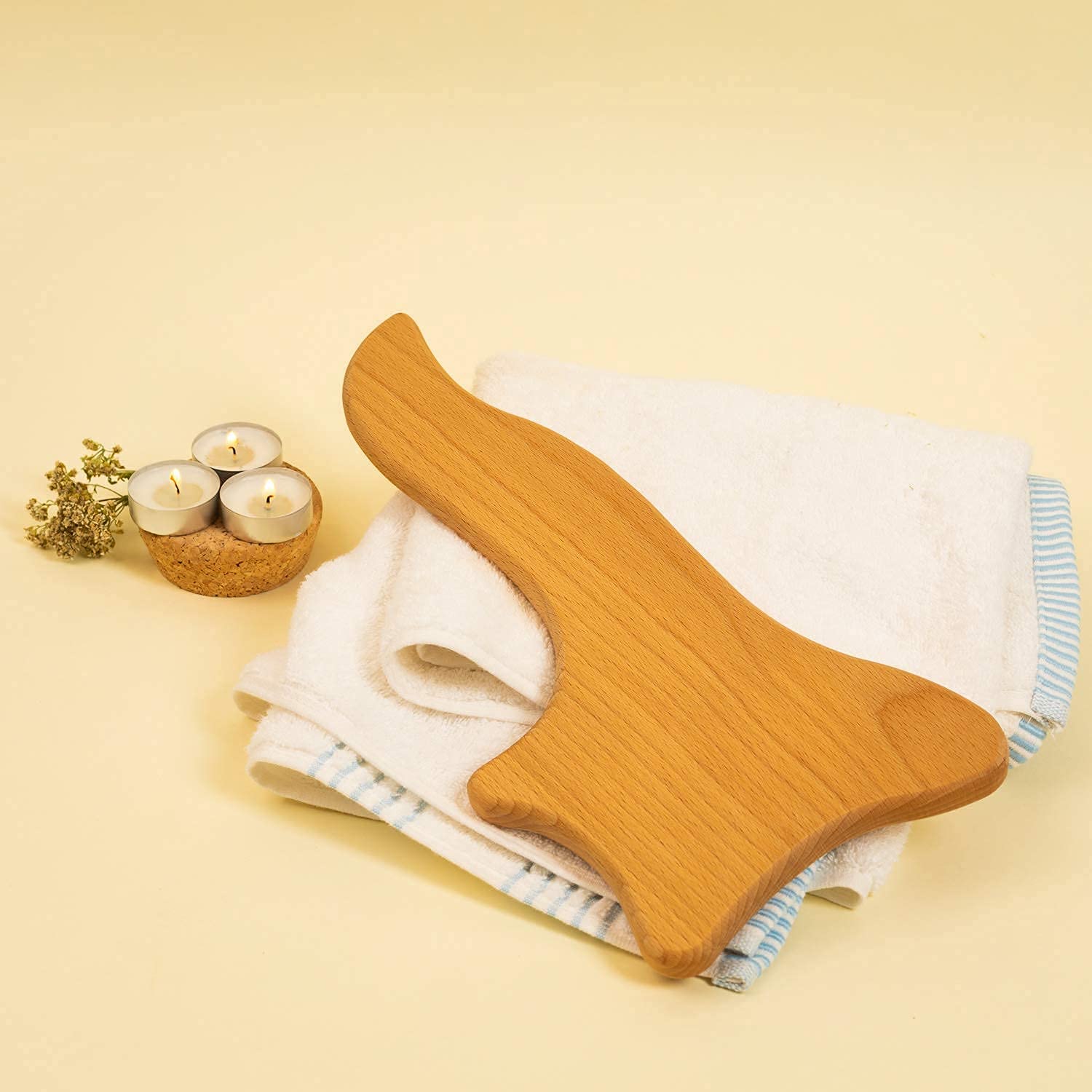 Lymphatic Drainage Paddle, an anti-cellulite Gua Sha tool made of wood, designed for massage and skin tightening.