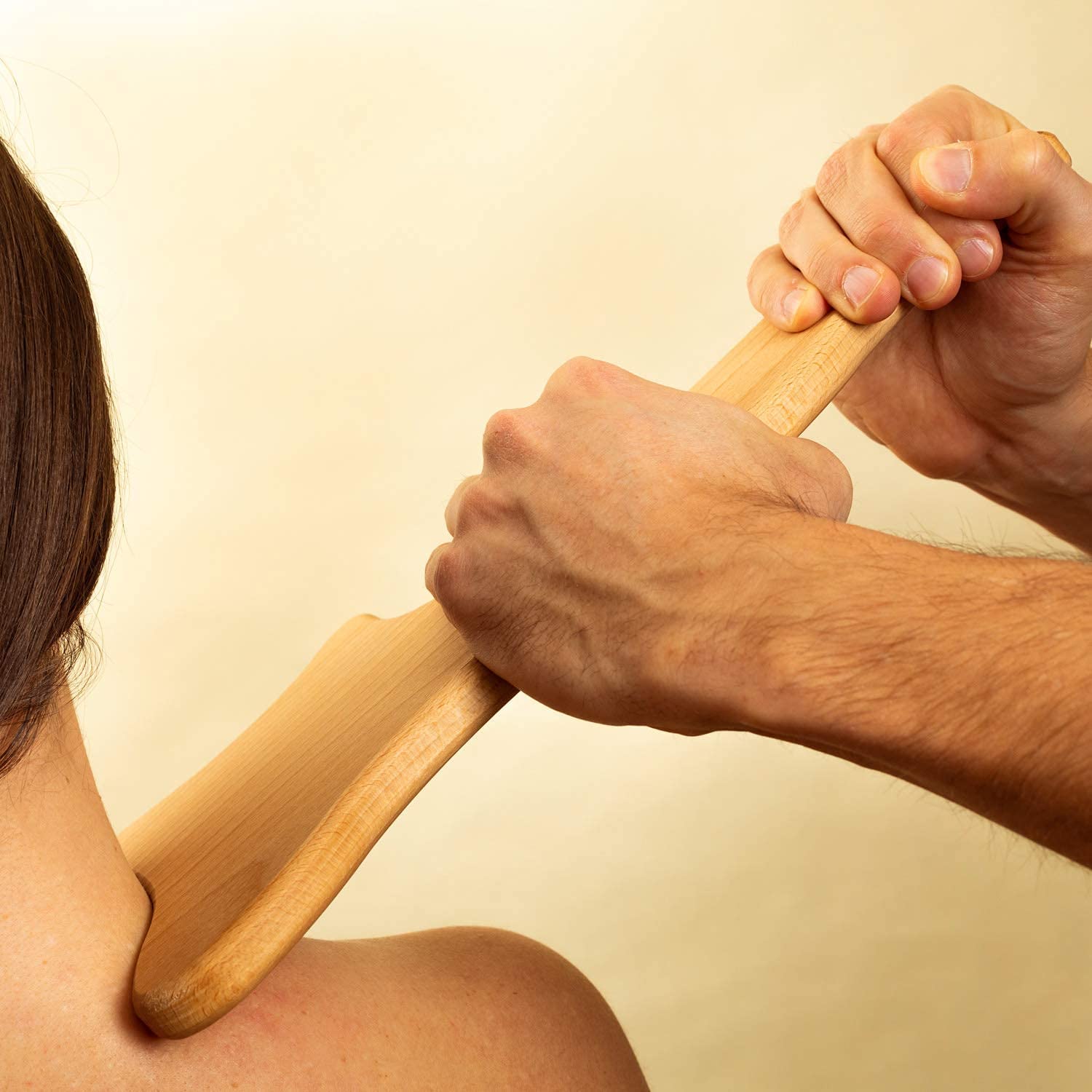 Lymphatic Drainage Paddle, an anti-cellulite Gua Sha tool made of wood, designed for massage and skin tightening.