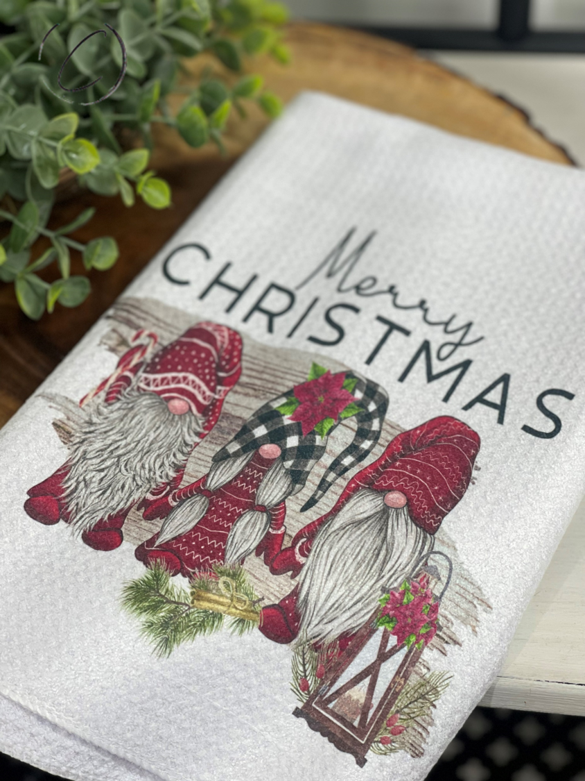 Merry Christmas Gnomes Waffle Weave Tea Towel featuring festive gnome design, perfect for holiday kitchens.