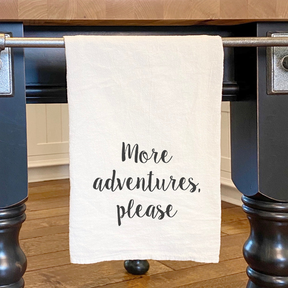 More Adventures Please cotton tea towel featuring vibrant designs, made from 100% absorbent cotton, perfect for kitchen use.