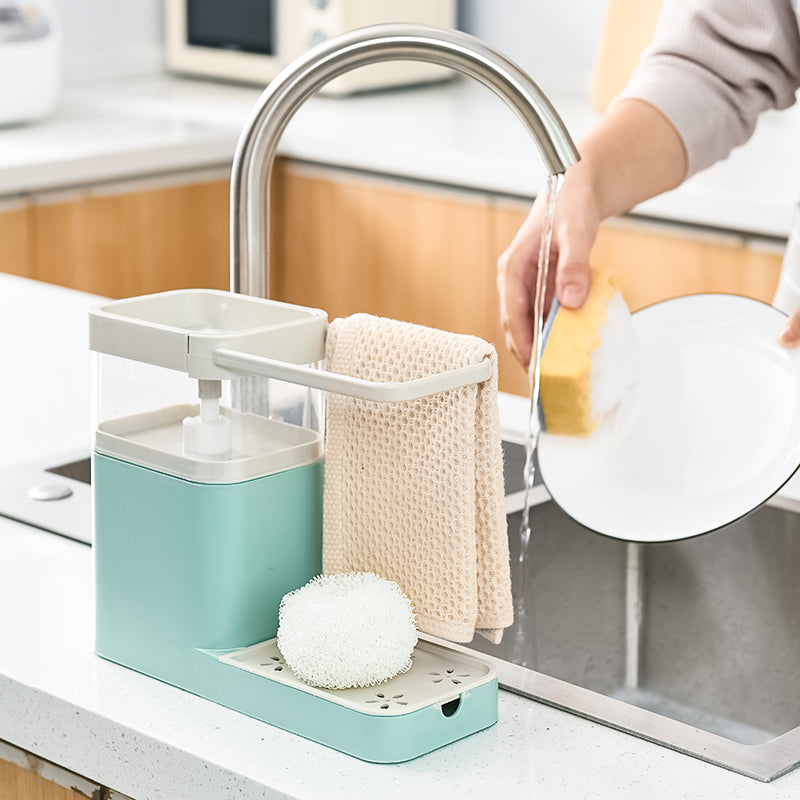 Multifunctional Kitchen Cleaning Combination Rack featuring soap dispenser, sponge holder, and towel shelf in gray, green, and pink colors.