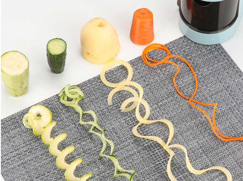 Multi-functional Vertical Spiral Hand Filament Cutter with transparent container and various vegetable slices.
