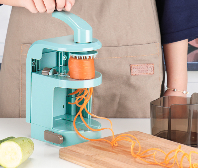 Multi-functional Vertical Spiral Hand Filament Cutter with transparent container and various vegetable slices.