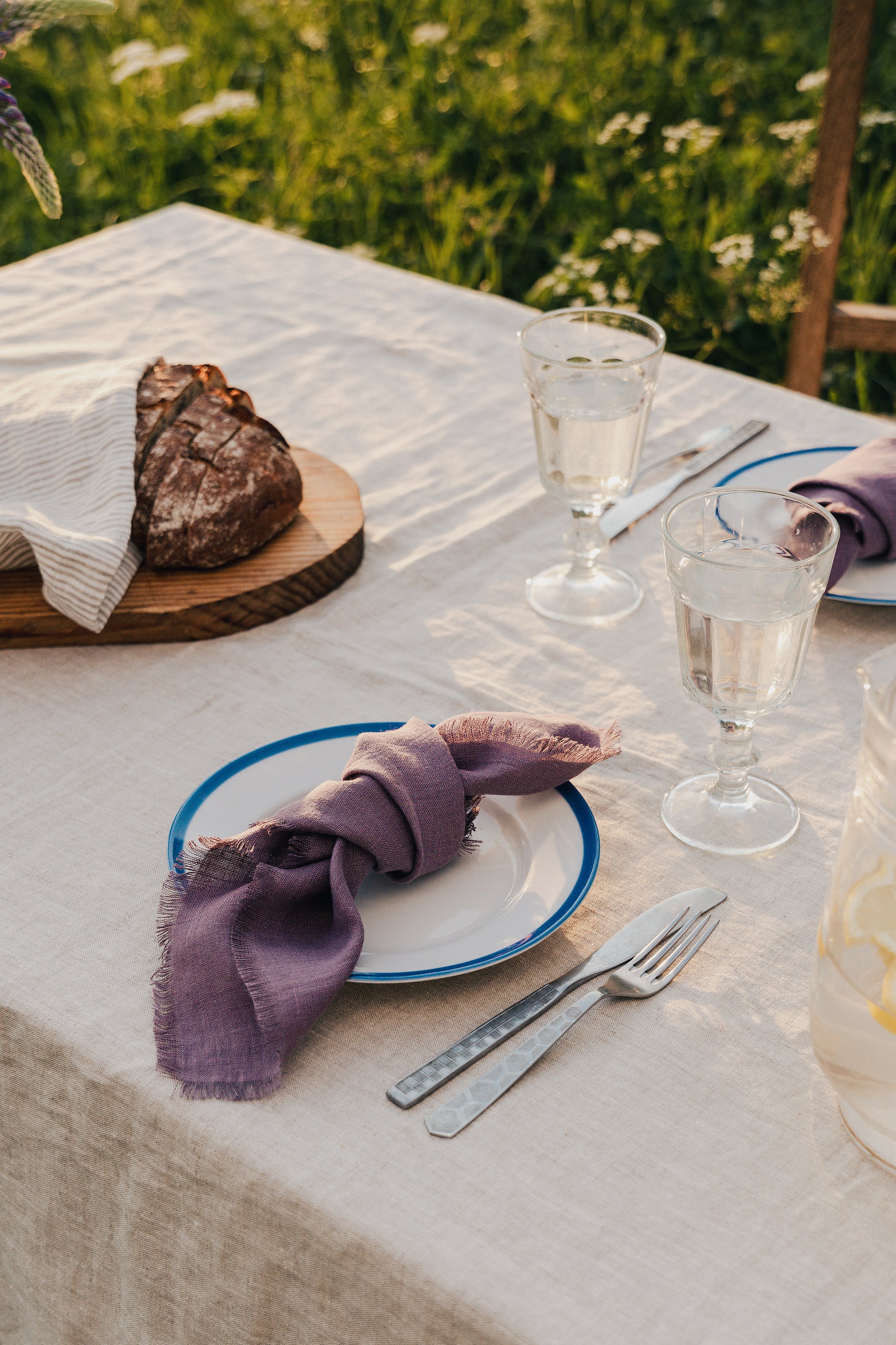 Set of two mustard linen napkins with tassels, showcasing a soft texture and elegant design, perfect for modern dining decor.