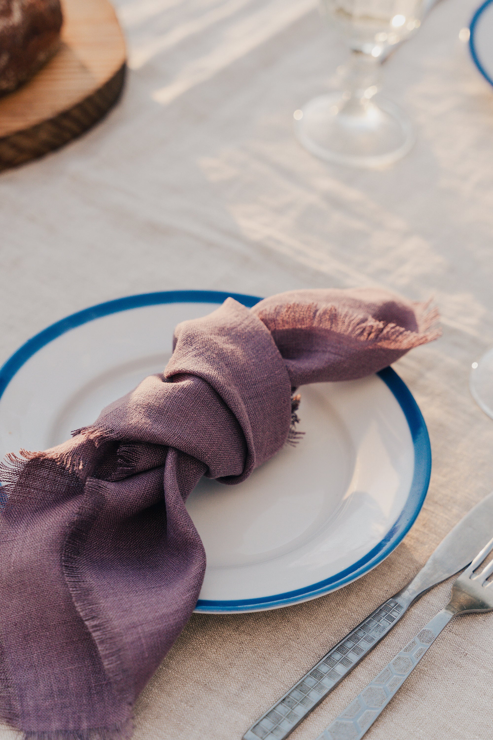 Set of two mustard linen napkins with tassels, showcasing a soft texture and elegant design, perfect for modern dining decor.