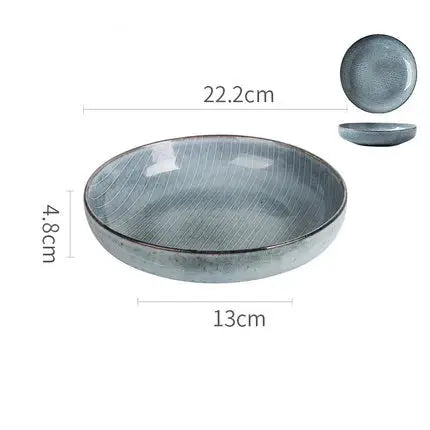 A beautifully handcrafted Naomi Bowl made from durable Jiarun porcelain, featuring a vibrant blue color and a lightweight design.