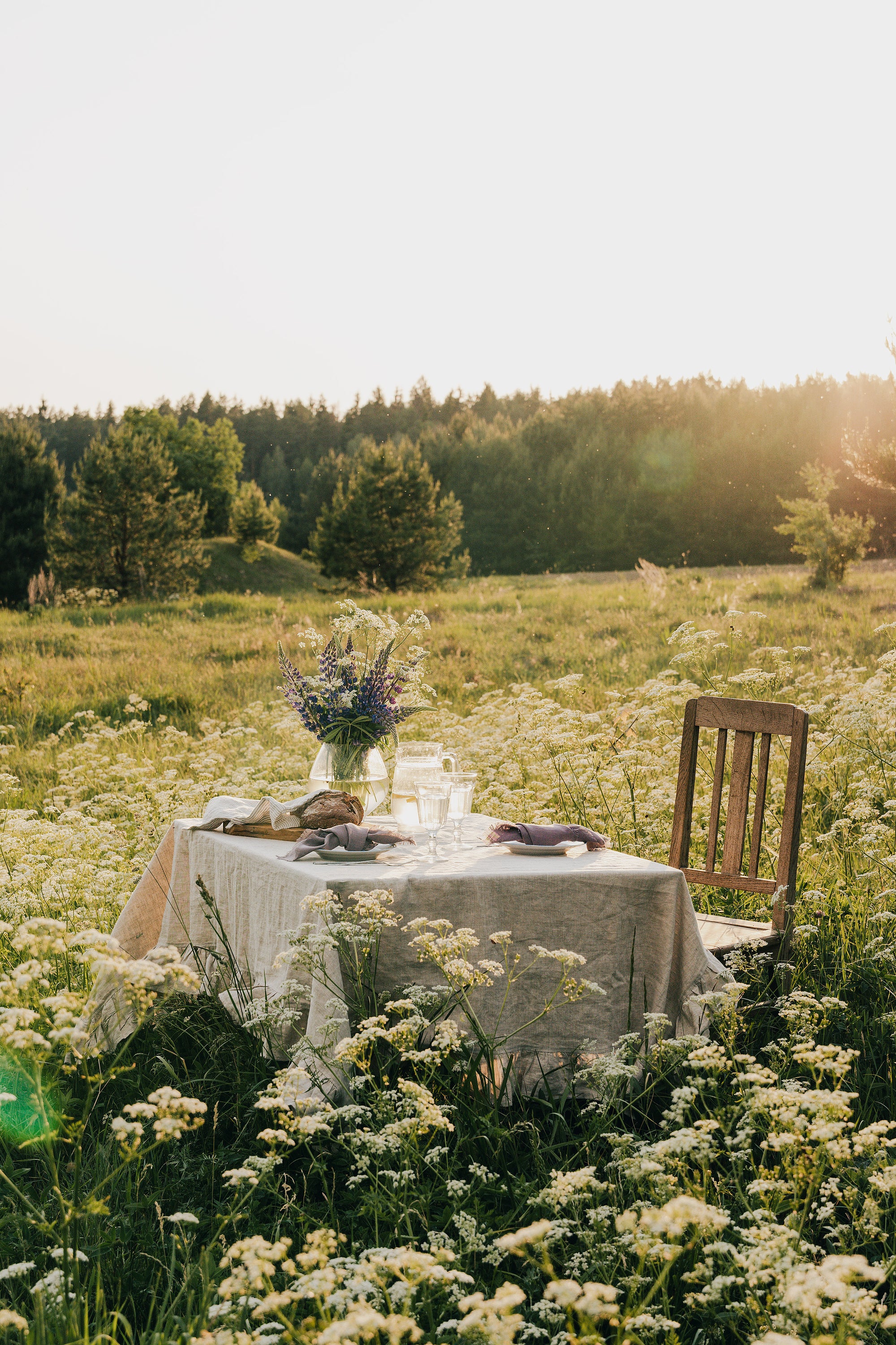 Natural Light linen tablecloth with elegant ruffles, showcasing high-quality European linen in a soft, inviting color.