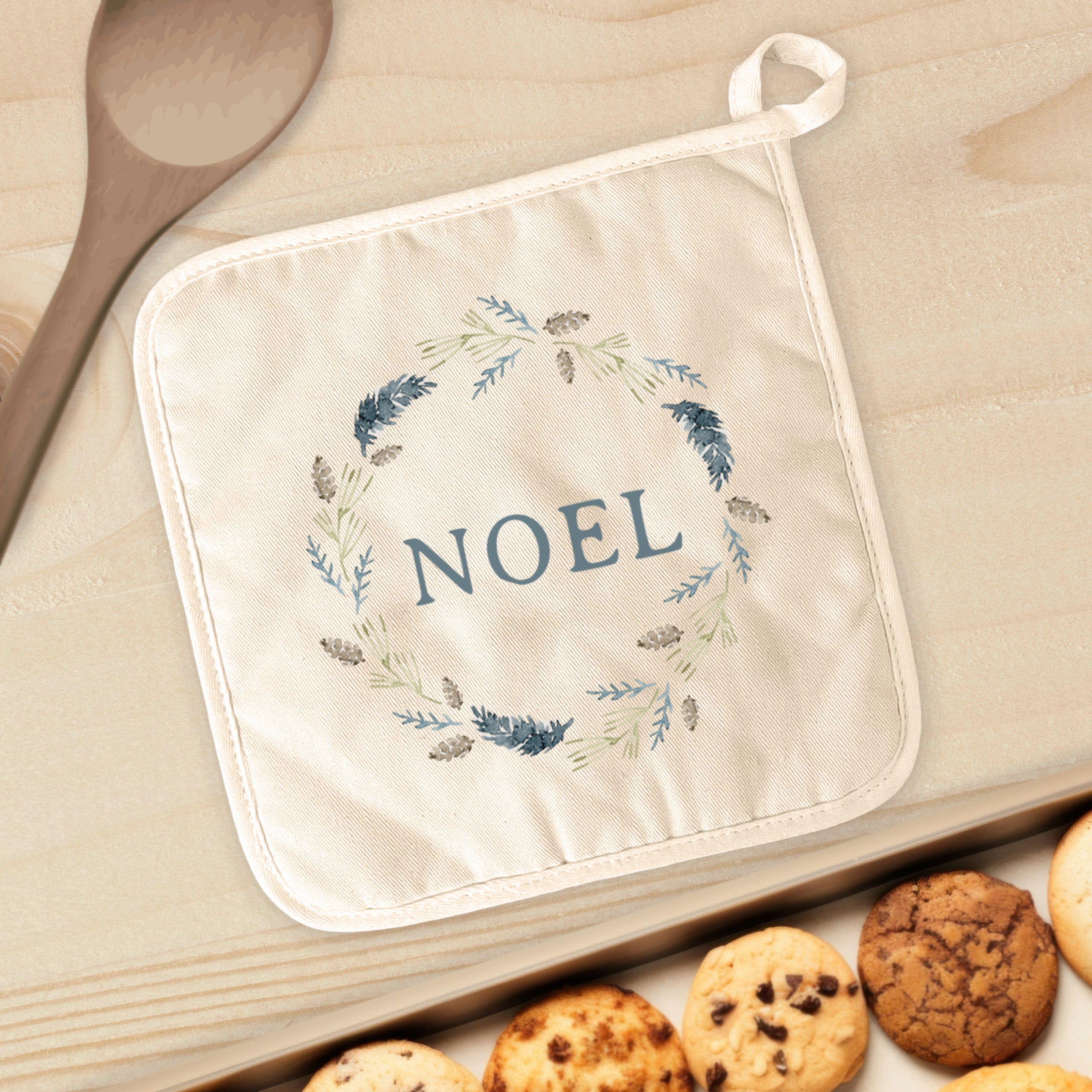 Noel Pine Wreath cotton pot holder featuring a vibrant design, perfect for protecting surfaces from hot cookware.