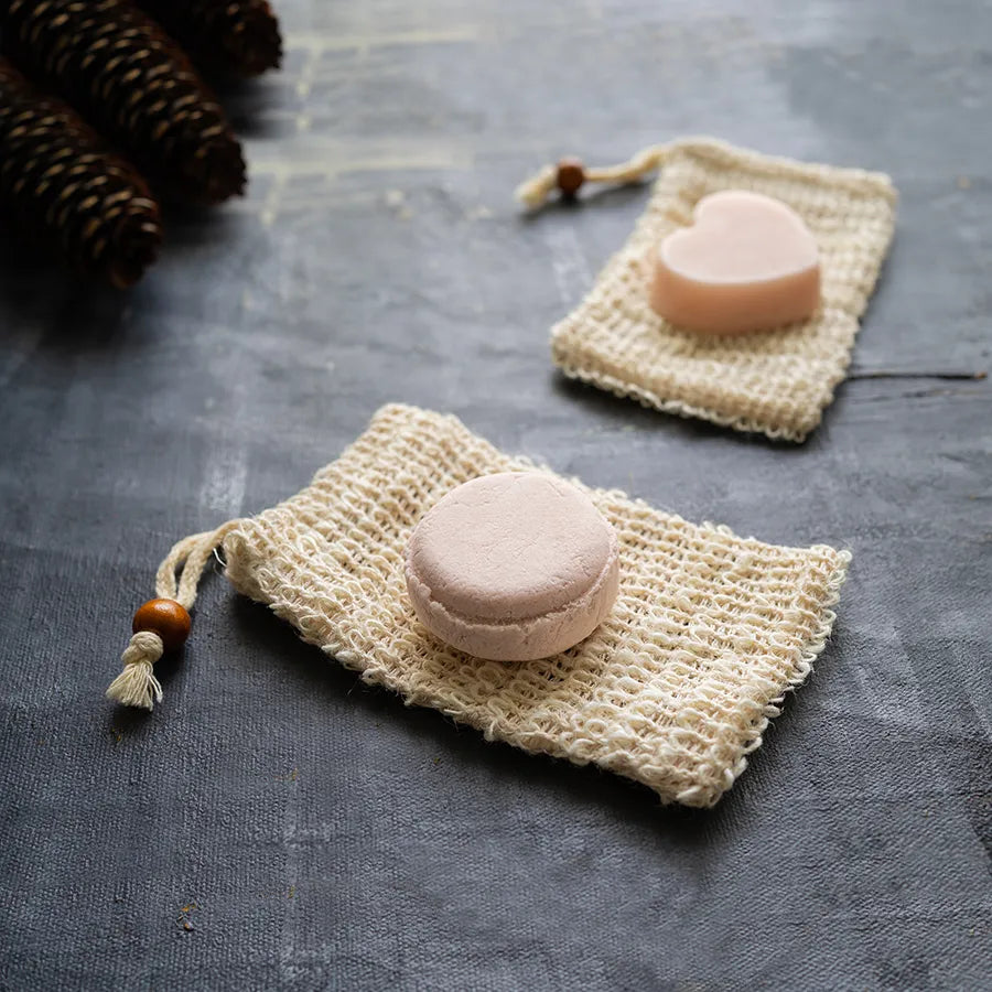 Nourishing Shampoo and Conditioner Bar Set featuring argan oil, eco-friendly packaging, and a minimalist design for color-treated hair care.