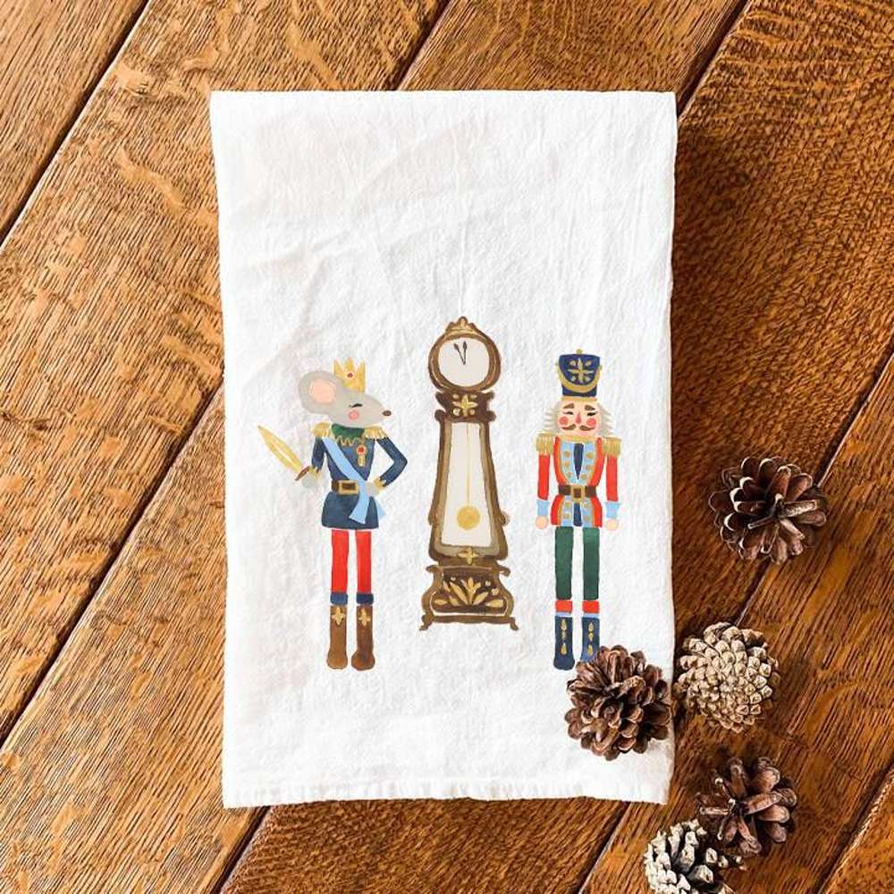 Cotton tea towel featuring Nutcracker, Mouse King, and Clock design, vibrant colors on a white background, perfect for festive kitchen decor.