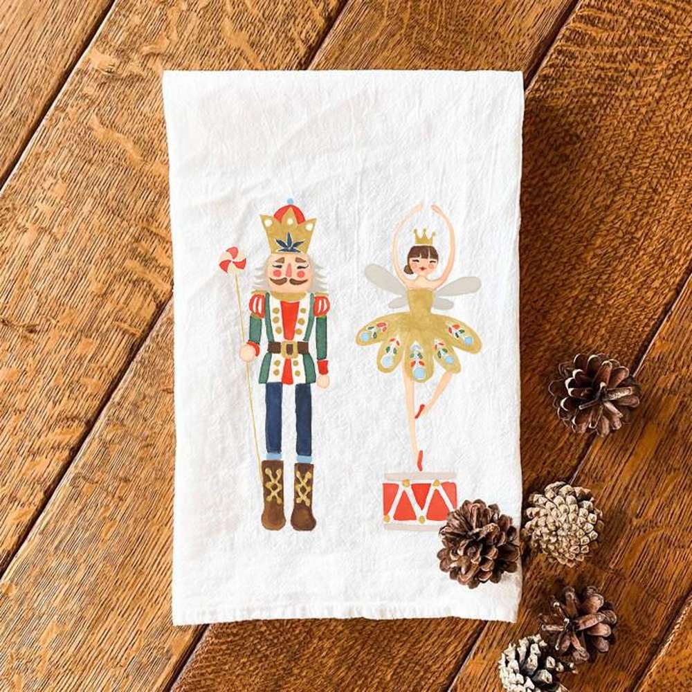 Nutcracker King with Snow Queen cotton tea towel featuring vibrant colors and festive design, perfect for holiday kitchens.