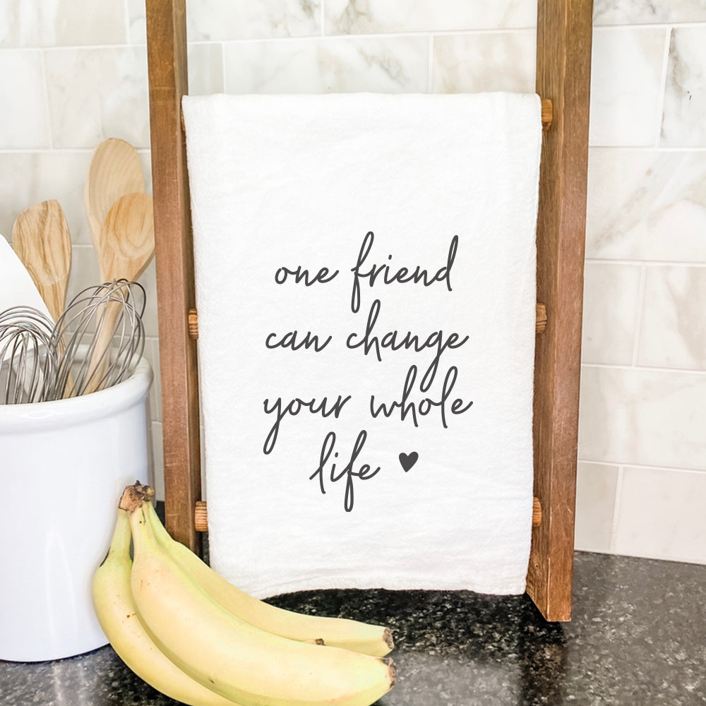 One Friend Cotton Tea Towel featuring a vibrant design, made from 100% absorbent cotton, displayed on a kitchen countertop.