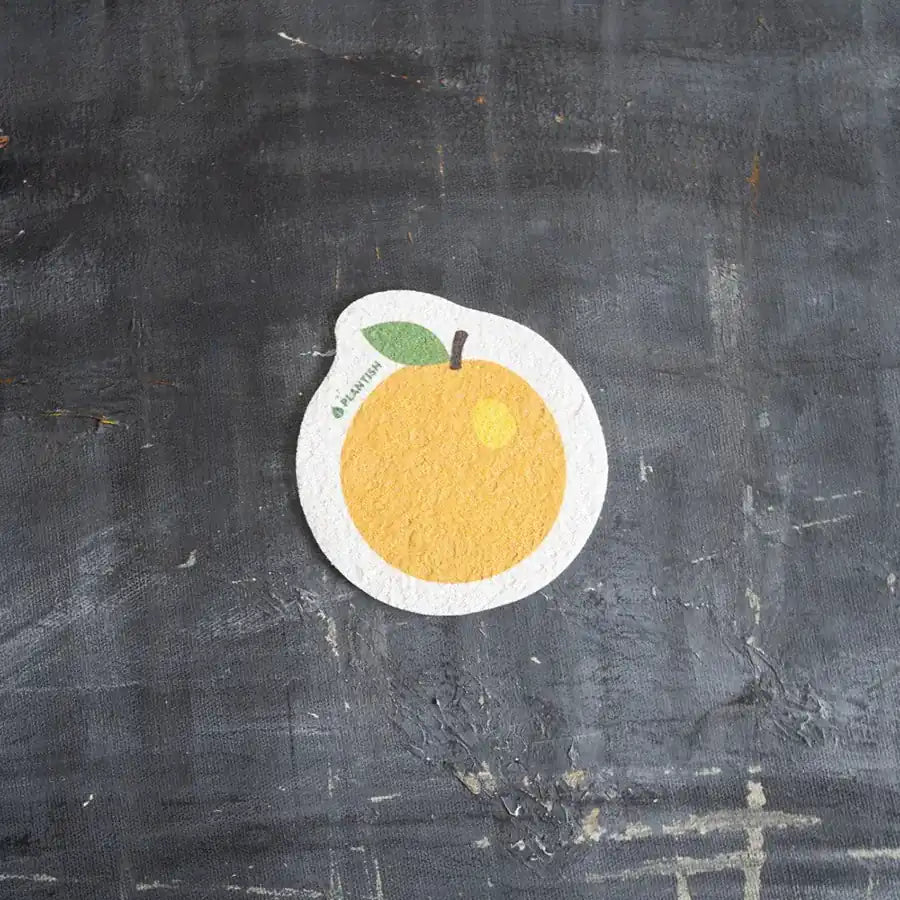 Orange Pop-up Sponge made from 100% vegetable cellulose, eco-friendly and biodegradable, perfect for kitchen cleaning.