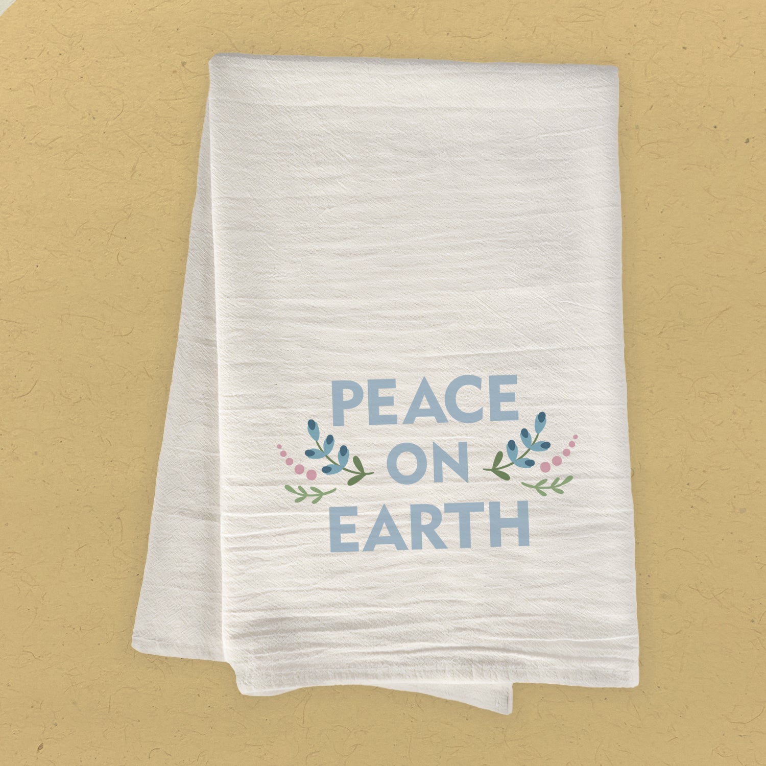 Peace on Earth Cotton Tea Towel featuring vibrant design, made from 100% absorbent cotton, ideal for kitchen use.