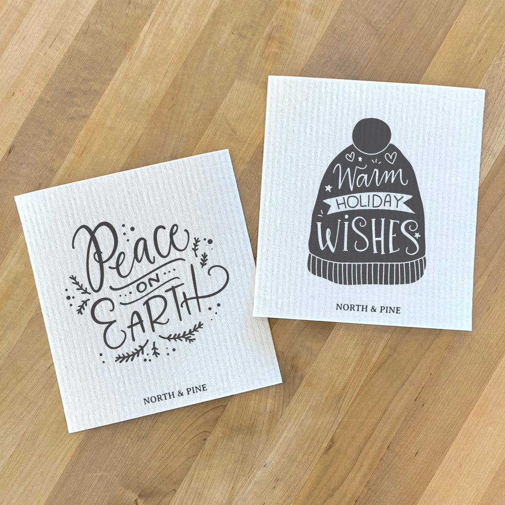 Two Swedish dish cloths featuring holiday designs, made from eco-friendly materials.