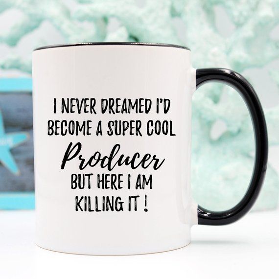 A stylish white ceramic mug designed for producers, featuring a vibrant print on both sides, perfect for coffee or tea.