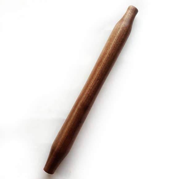 Hand-turned tapered French rolling pin made from pre-fallen lumber, featuring a smooth finish and natural wood grain.