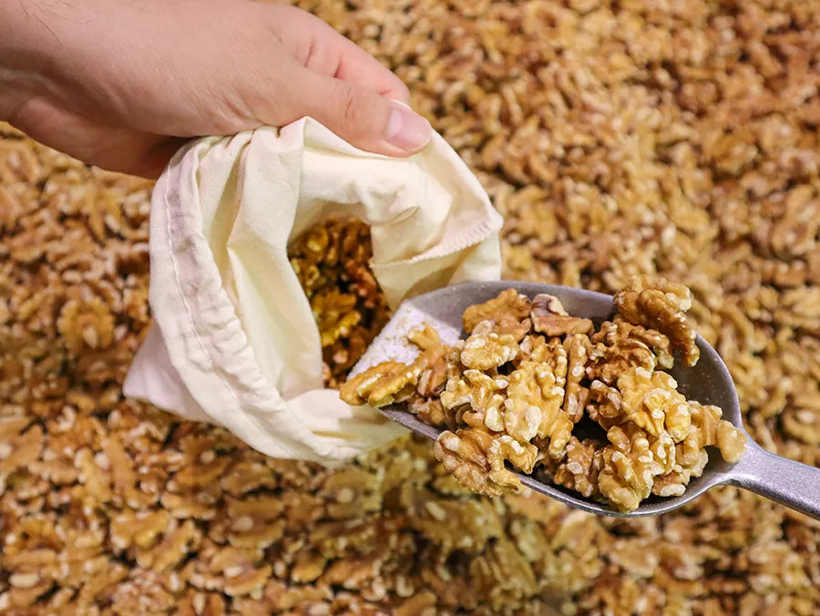 Set of 4 Organic Cotton Muslin Produce Bags in various sizes, ideal for eco-friendly storage and shopping.