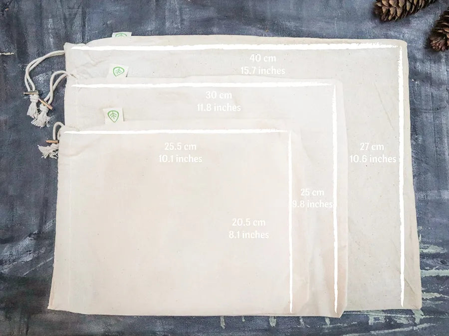 Set of 4 Organic Cotton Muslin Produce Bags in various sizes, ideal for eco-friendly storage and shopping.