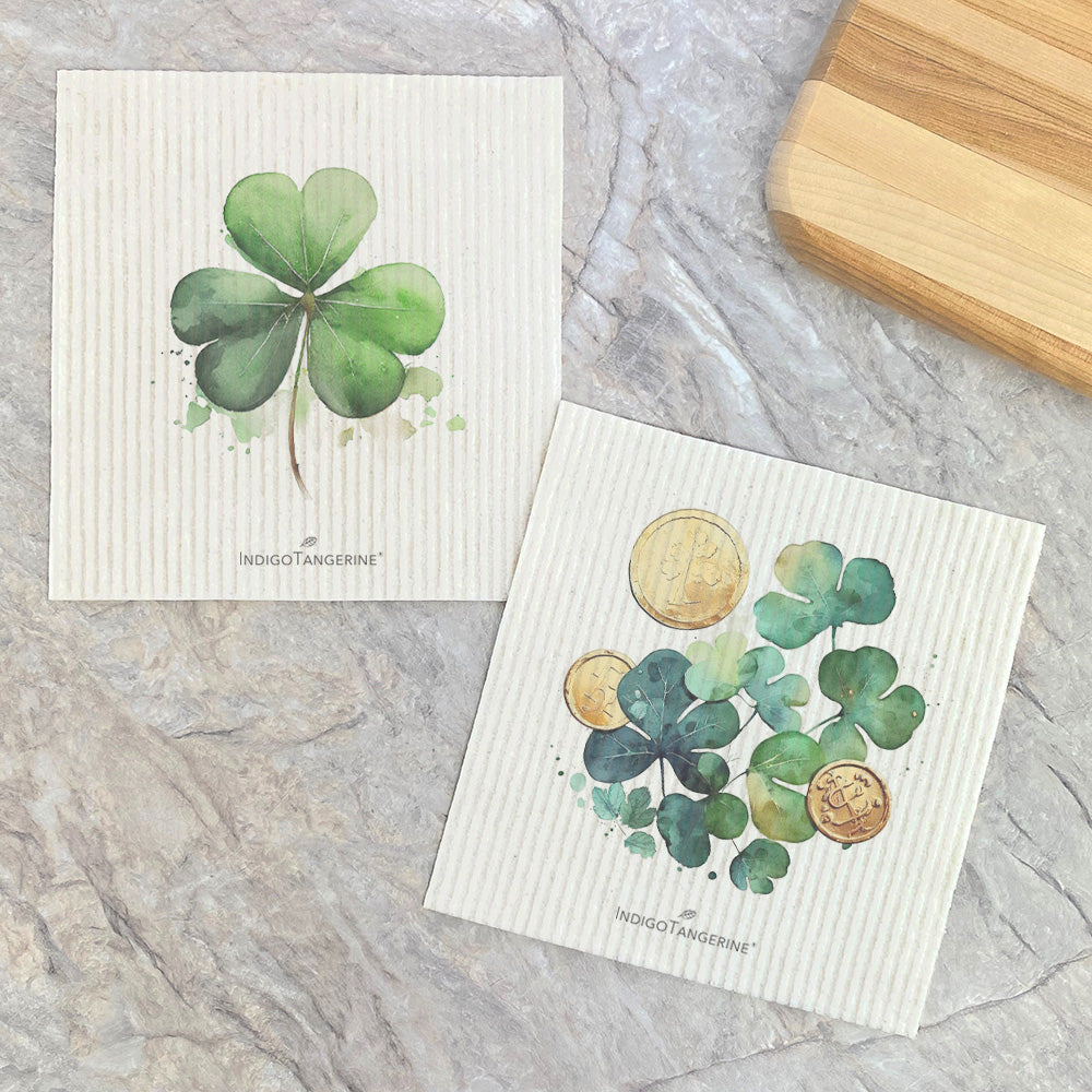 Two Swedish dish cloths featuring shamrocks and coins designs, made from eco-friendly materials.