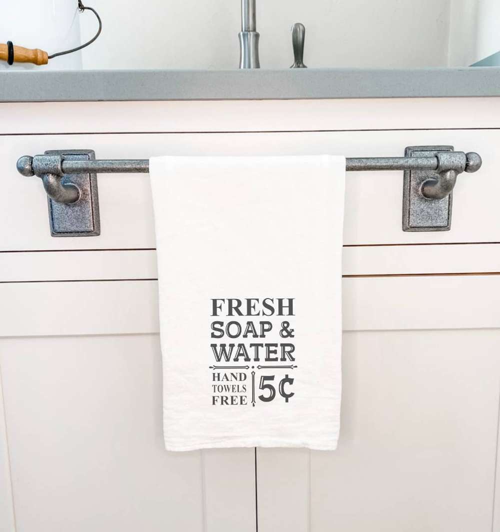 Soap and Water Cotton Tea Towel featuring vibrant design, 100% cotton, and hemmed edges, ideal for kitchen use.