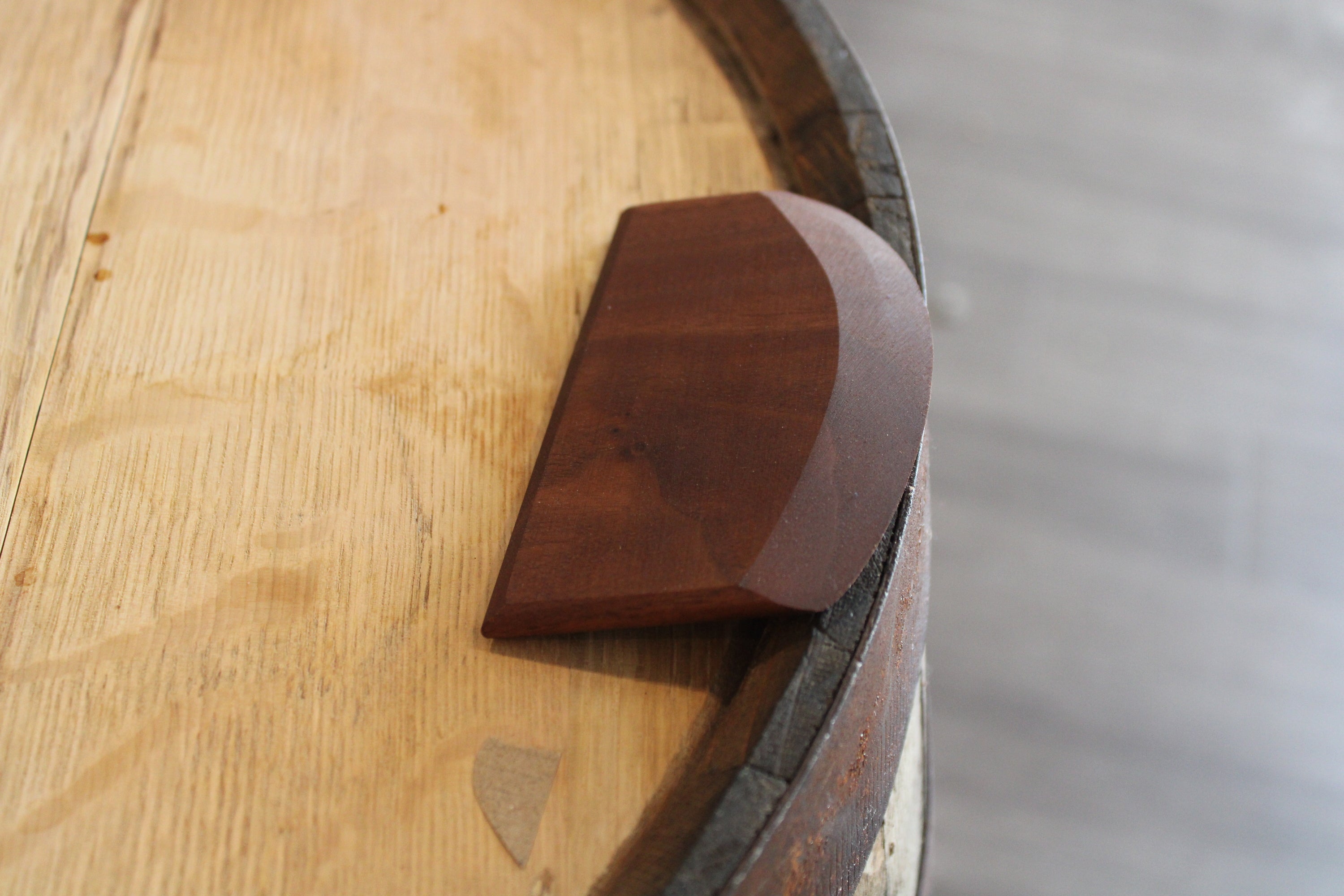 Artisan handmade sourdough proofing bowl scraper made from Cherry, Maple, Oak, or Walnut, featuring a curved design for easy dough handling.