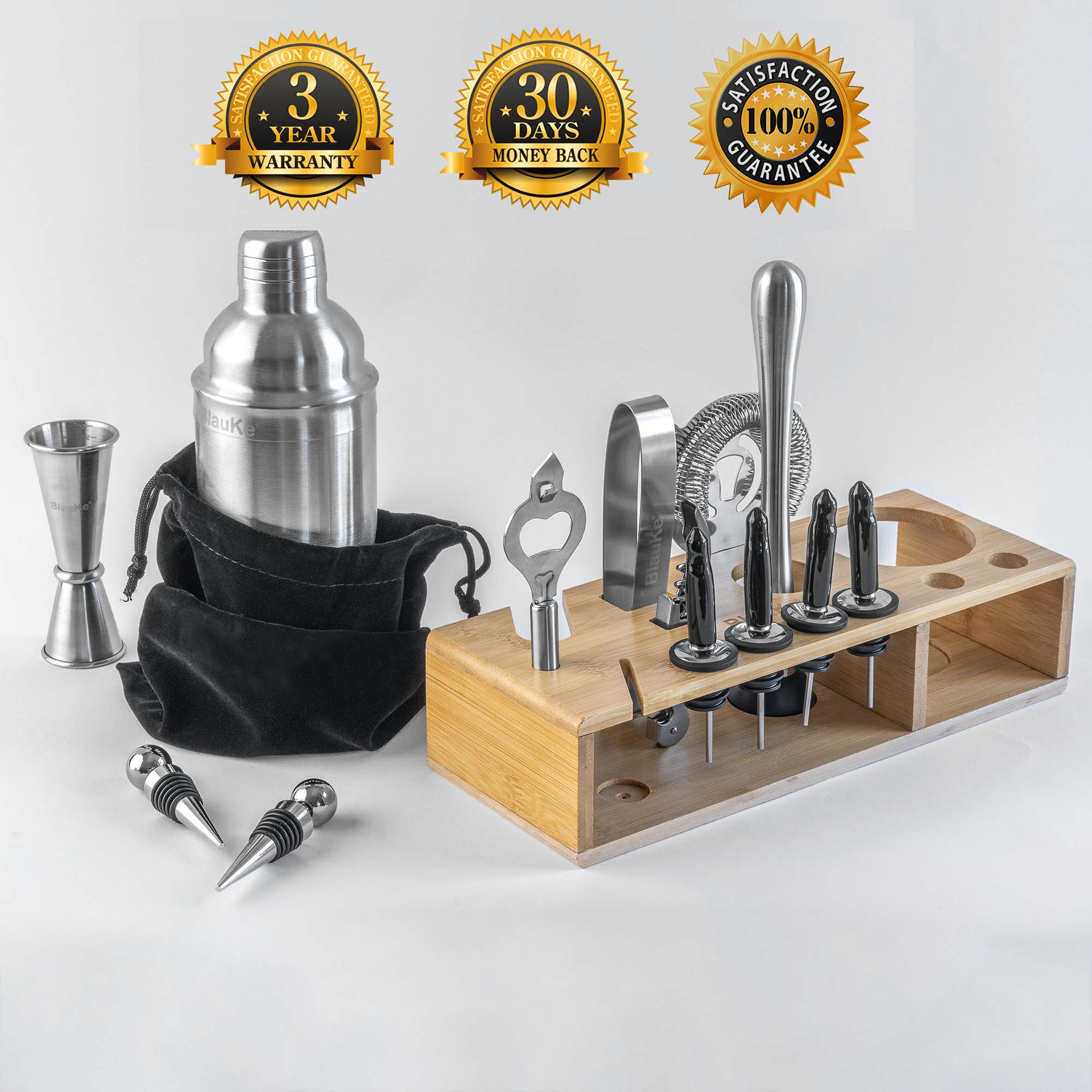 A complete 17-piece stainless steel cocktail shaker set displayed on an elegant bamboo stand, showcasing various bar tools including a shaker, jigger, and strainer.
