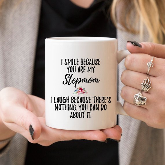A white ceramic mug designed for stepmoms, featuring a vibrant printed design on both sides, showcasing quality craftsmanship.