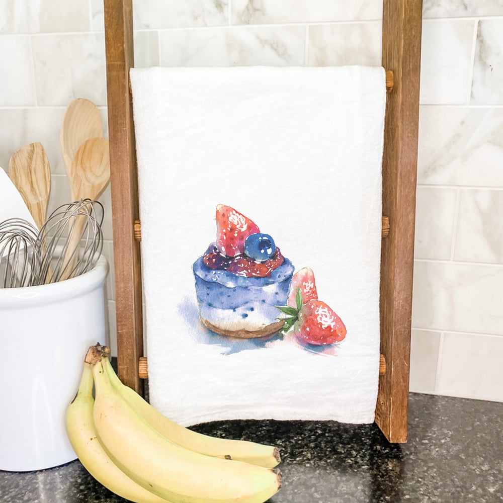 A vibrant Summer Cheesecake cotton tea towel featuring a beautiful design, perfect for kitchen use.