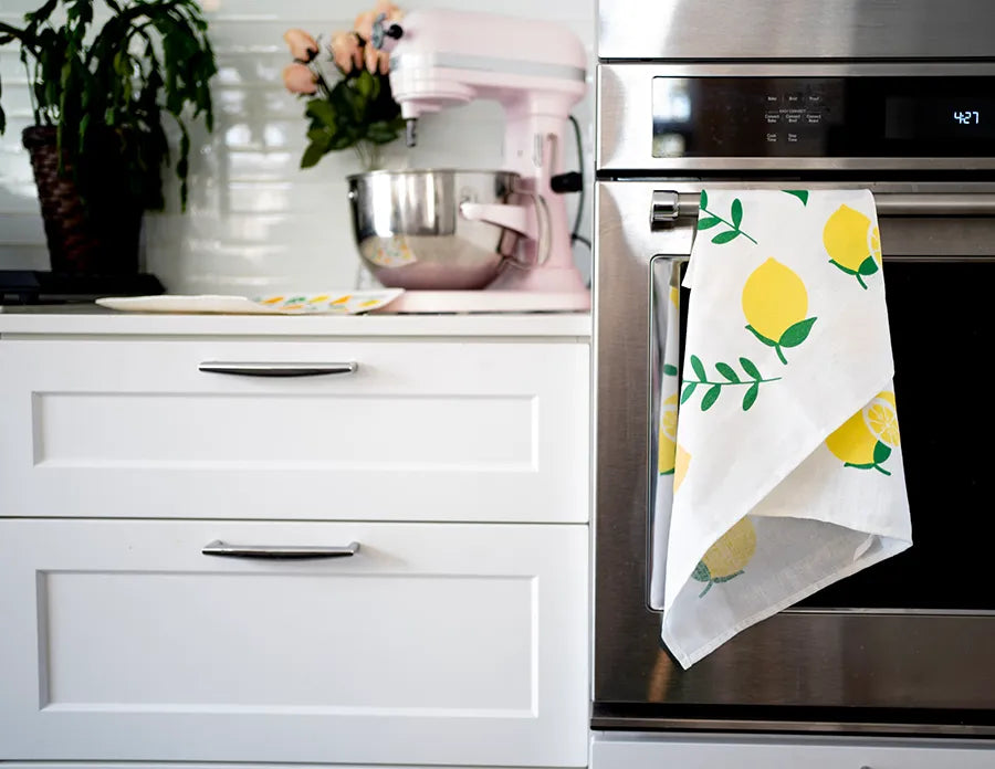 A Swedish Tea Towel made of linen and cotton, featuring a soft texture and a convenient hanging loop, ideal for kitchen use.