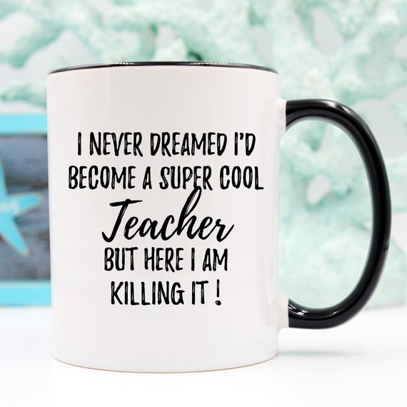 A white ceramic Teacher Mug featuring a humorous design, printed on both sides, perfect for coffee or tea.