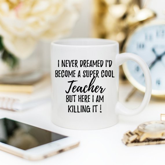 A white ceramic Teacher Mug featuring a humorous design, printed on both sides, perfect for coffee or tea.