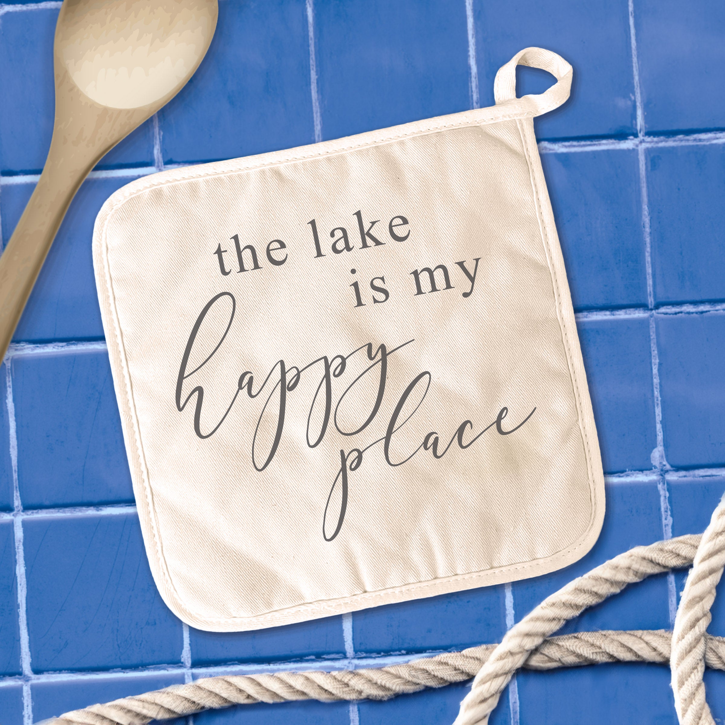 A square cotton pot holder featuring vibrant lake-themed designs, perfect for protecting surfaces from hot cookware.