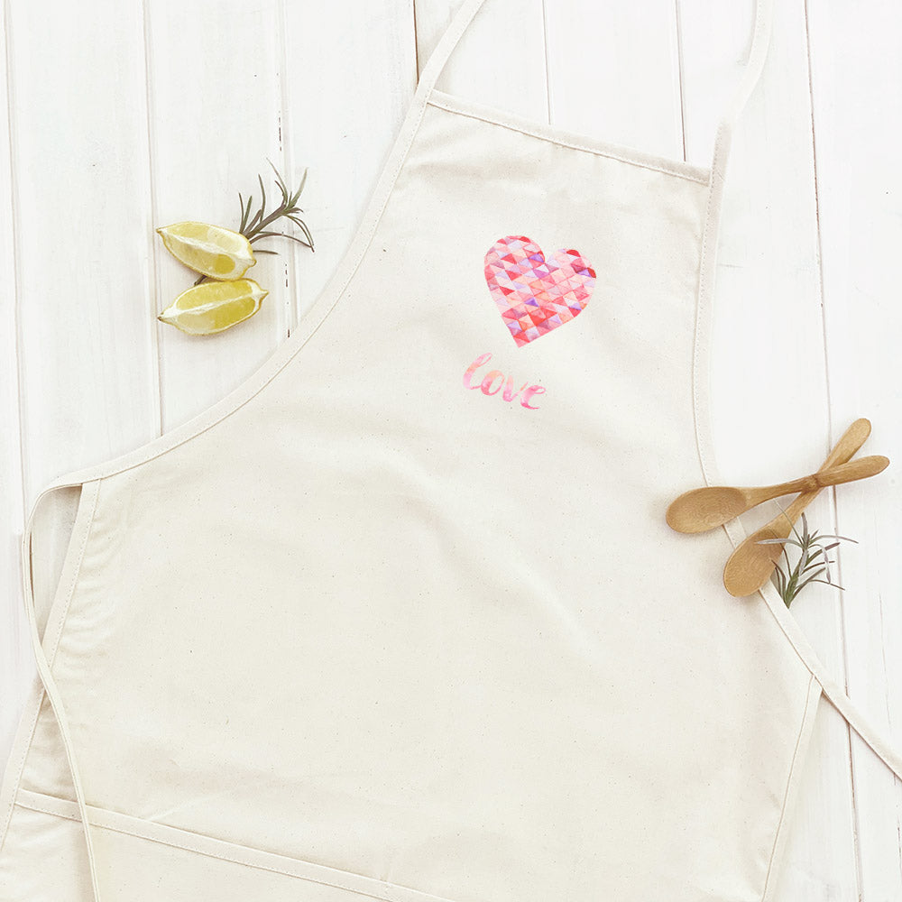 Triangle Heart Love Women's Apron featuring a stylish design with a divided front pocket and adjustable neck strap, made from durable cotton canvas.