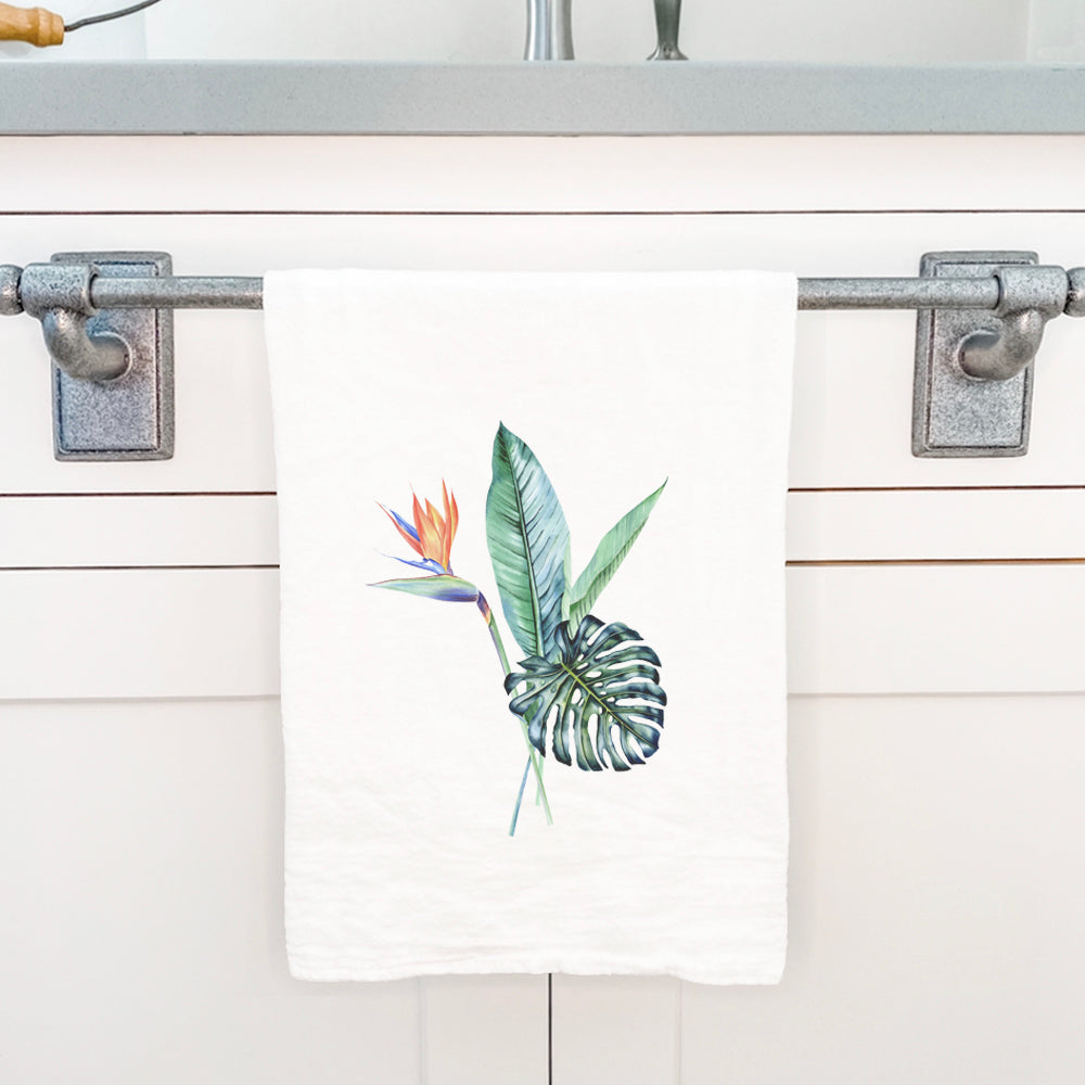 A vibrant Tropical Plants Cotton Tea Towel featuring lush green leaves and colorful tropical designs, perfect for kitchen use.