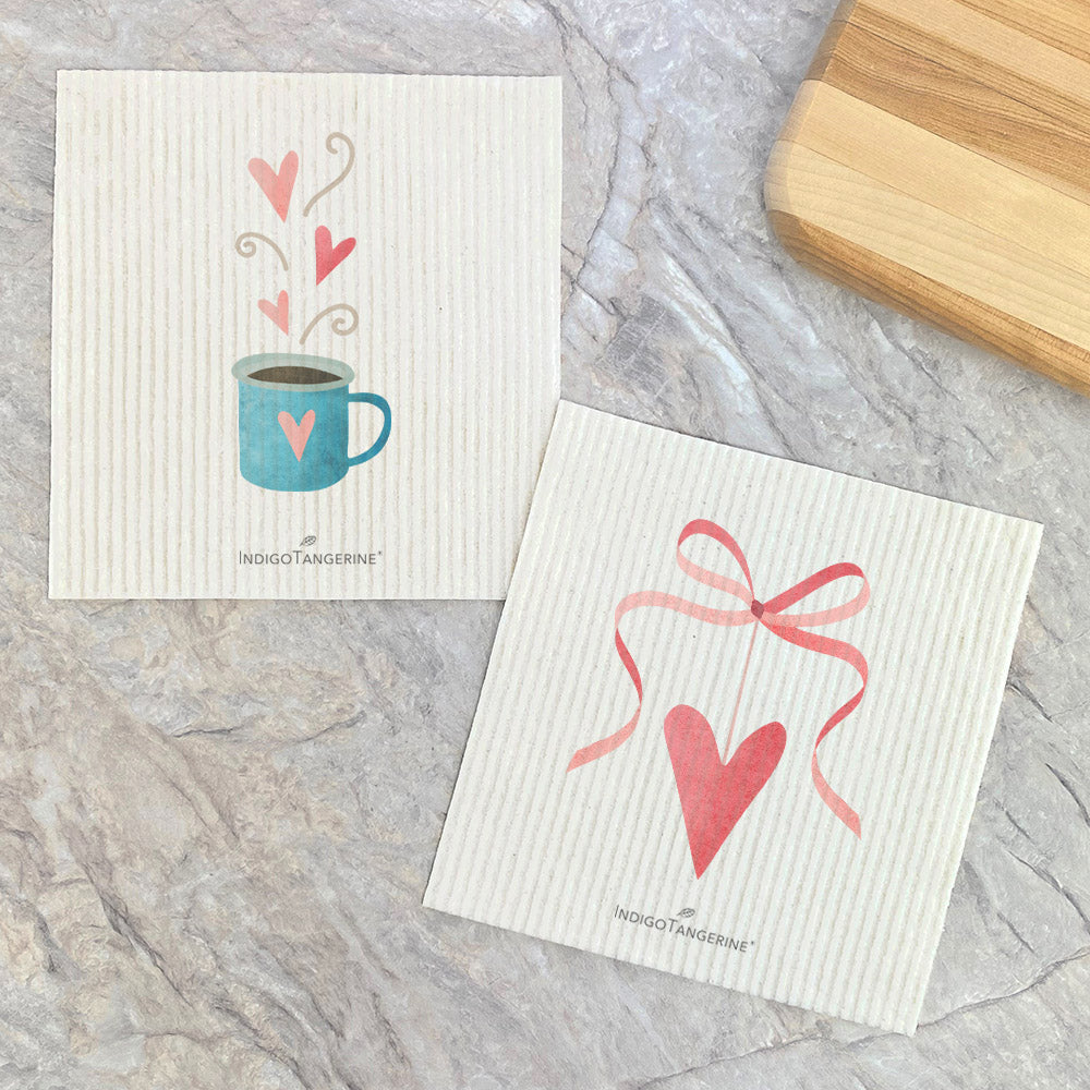Two eco-friendly Swedish dishcloths with Valentine's Coffee Ribbon Heart design, showcasing vibrant colors and patterns.