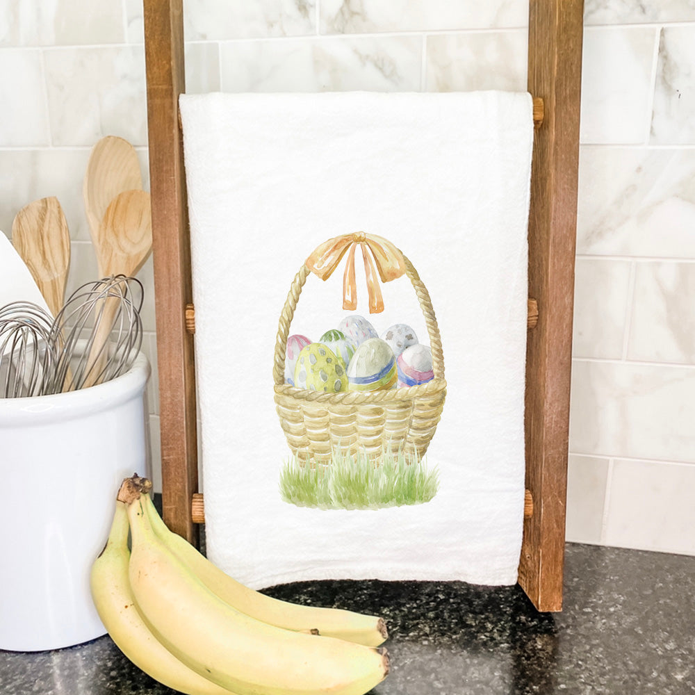 A vibrant Watercolor Easter Basket cotton tea towel featuring a colorful design, perfect for festive occasions and everyday kitchen use.